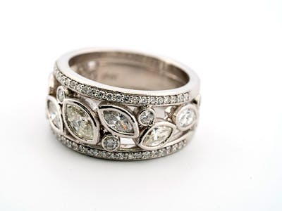 Marquise diamond wide band custom-made bezel set in platinum