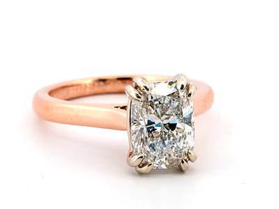 Lab-grown elongated cushion cut diamond set in a rose gold solitaire engagement ring