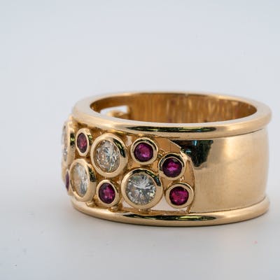 Round ruby and diamond wide band in yellow gold side view